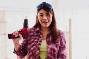 321 Handyman melbourne Palm Bay-woman-smiling-holding-power-drill-1500