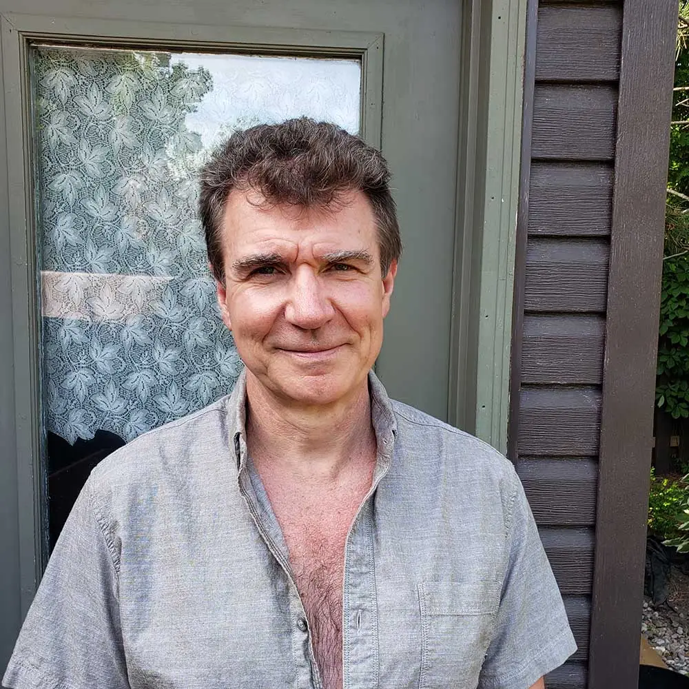 [Chris M] happy customer-man-stands-exterior outdoors-1000
