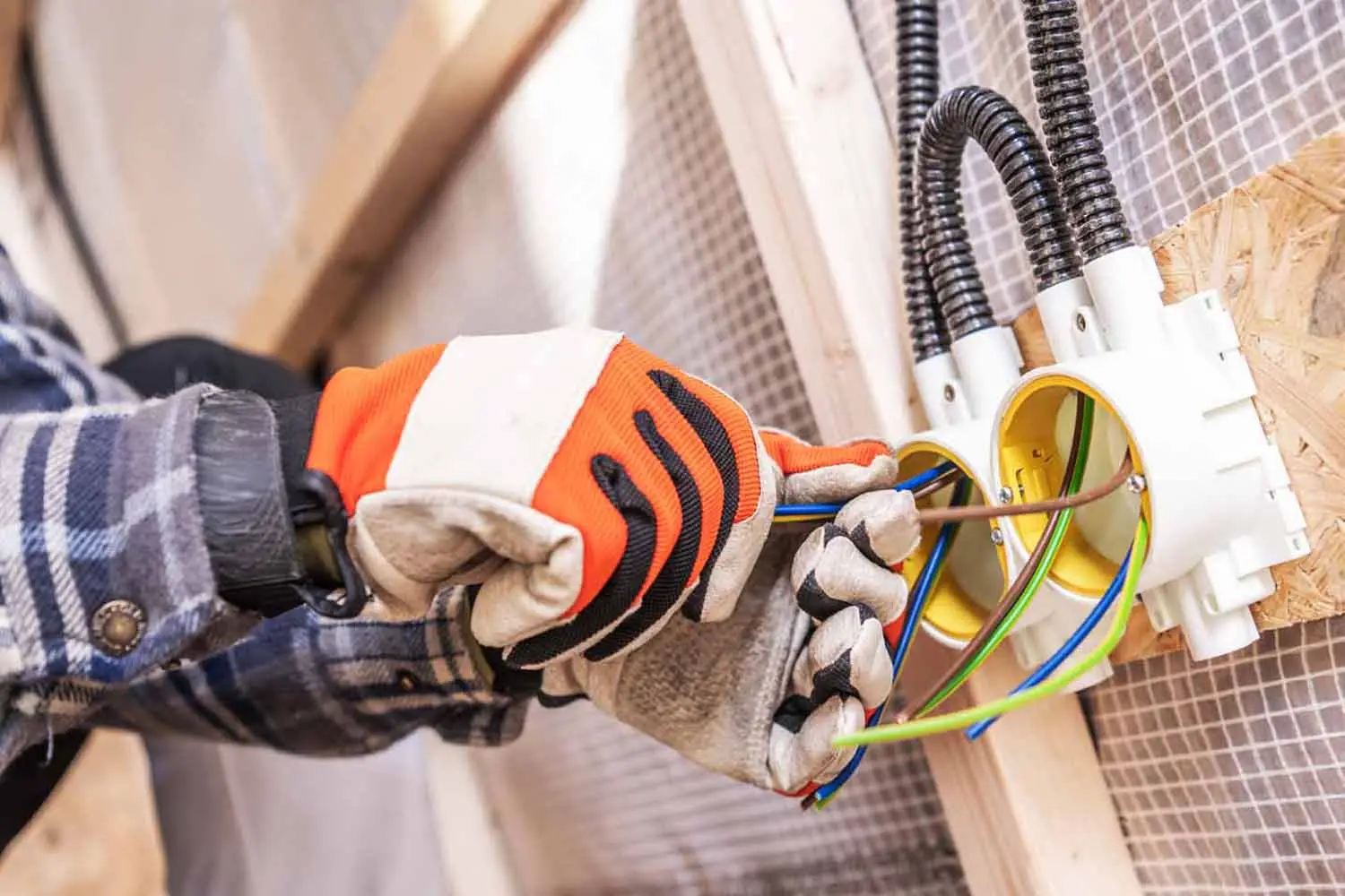 handyman-melbourne-palm bay-[electric] electrician-working-with-wires-in-a-construction-1500